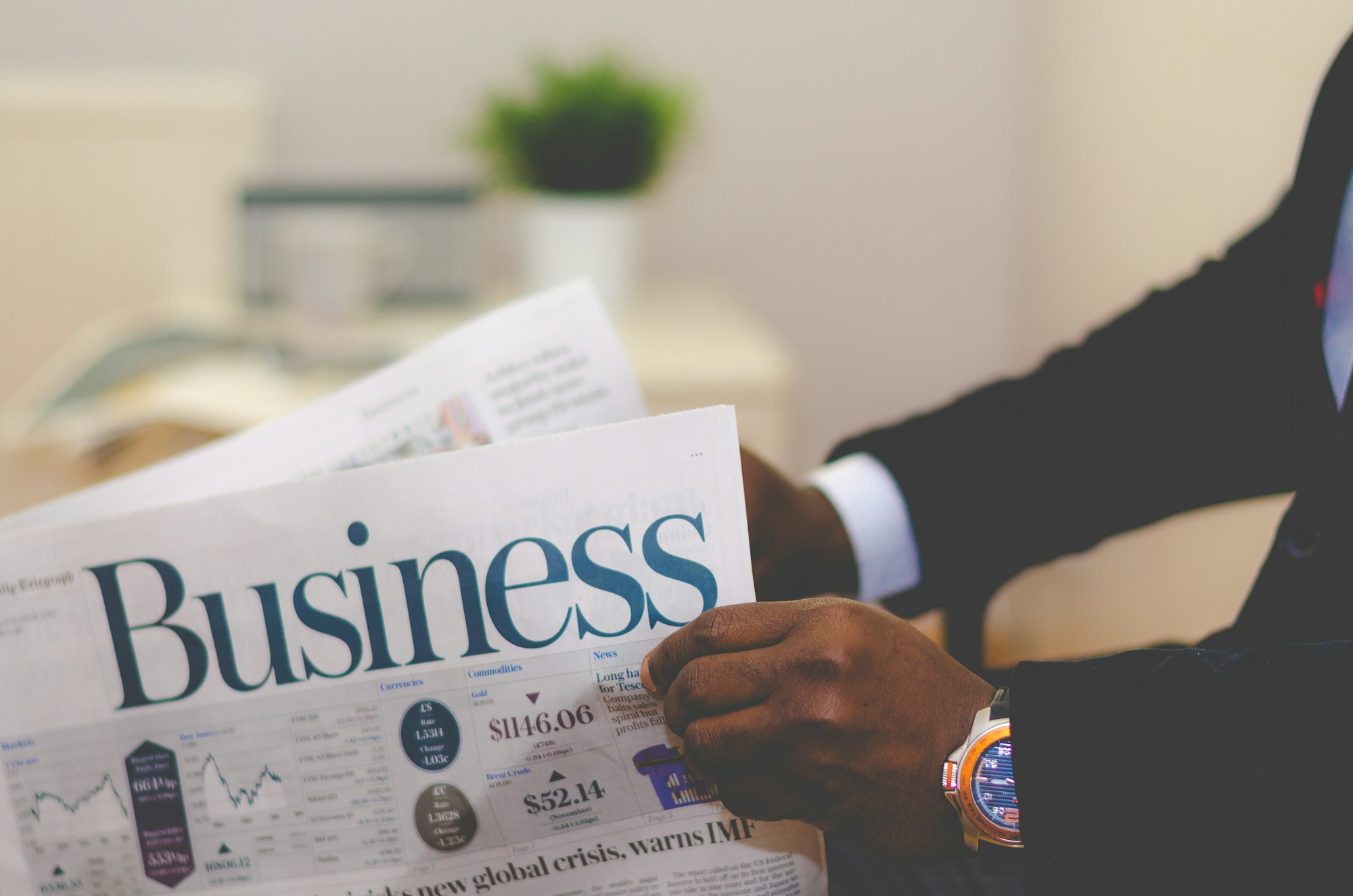 Financial research documents and market analysis on a desk